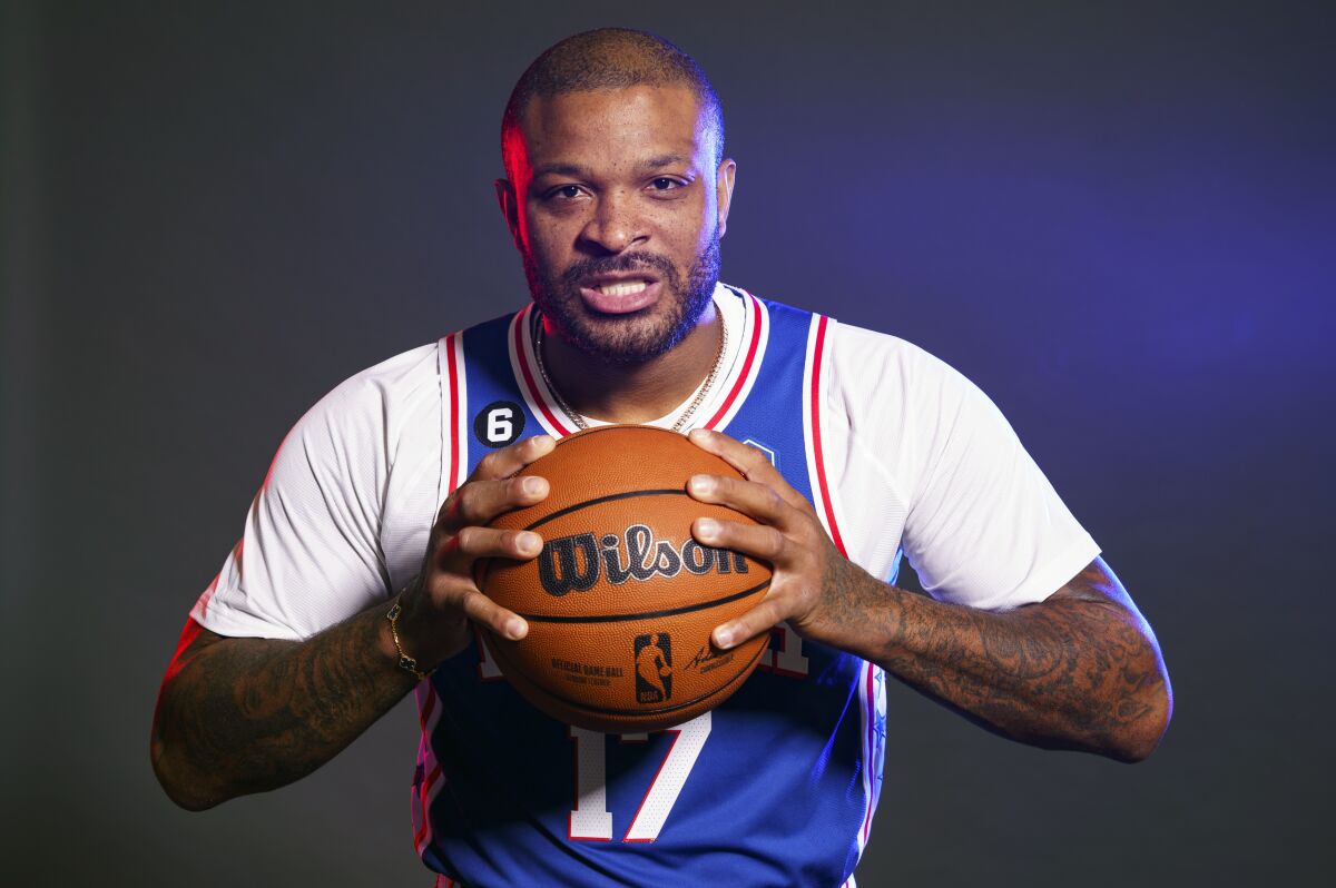 FILE -Philadelphia 76ers' P.J. Tucker poses for a photograph during media day at the NBA basketball team's practice facility, Monday, Sept. 26, 2022, in Camden, N.J. The Philadelphia 76ers are counting on P.J. Tucker to bring them a needed toughness. Sixers star Joel Embiid campaigned for the team to sign a player like Tucker after they lost to the Heat in the playoffs. (AP Photo/Chris Szagola, File)