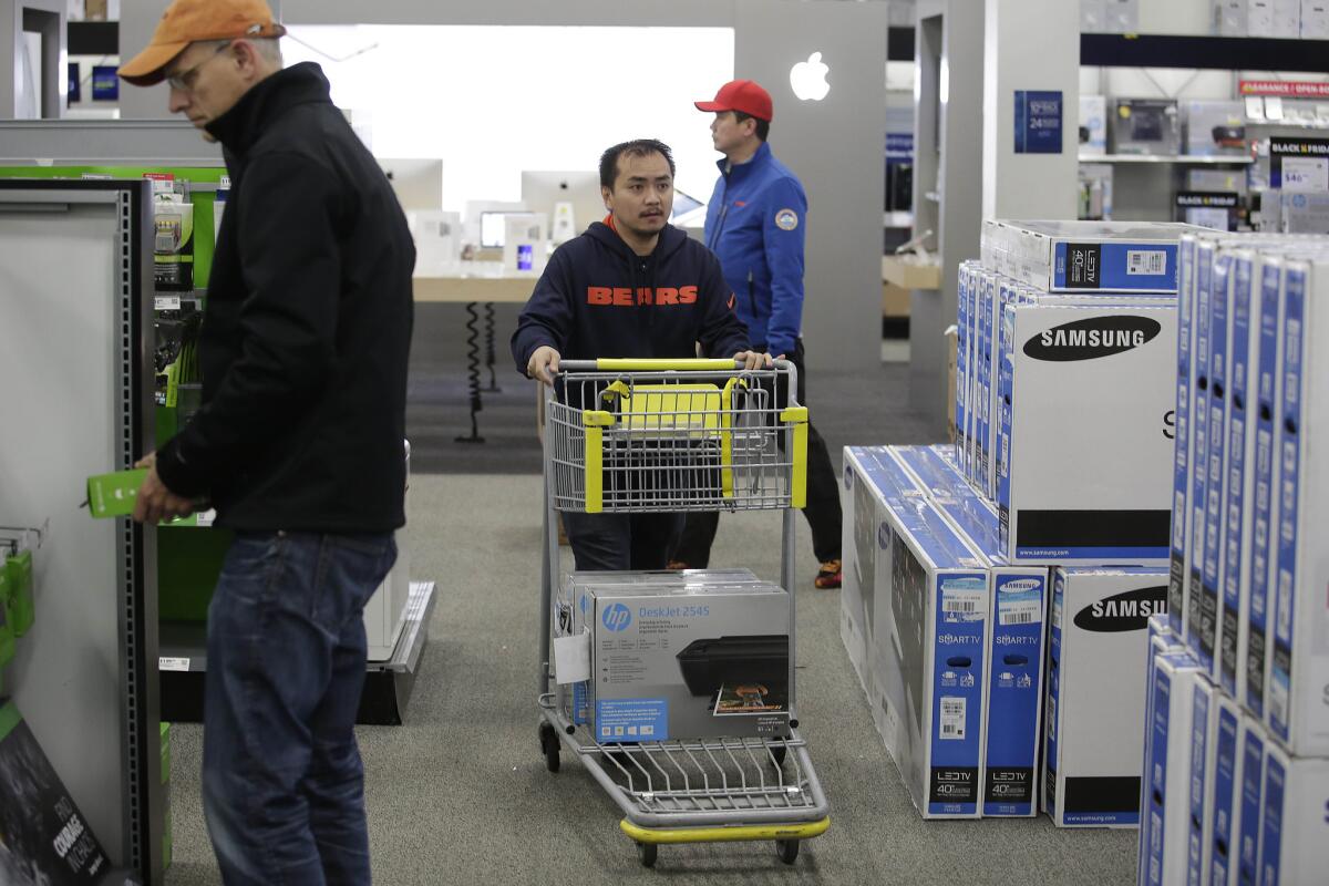 Customers shop for electronics and other items at a Best Buy in Illinois on on Nov. 27.