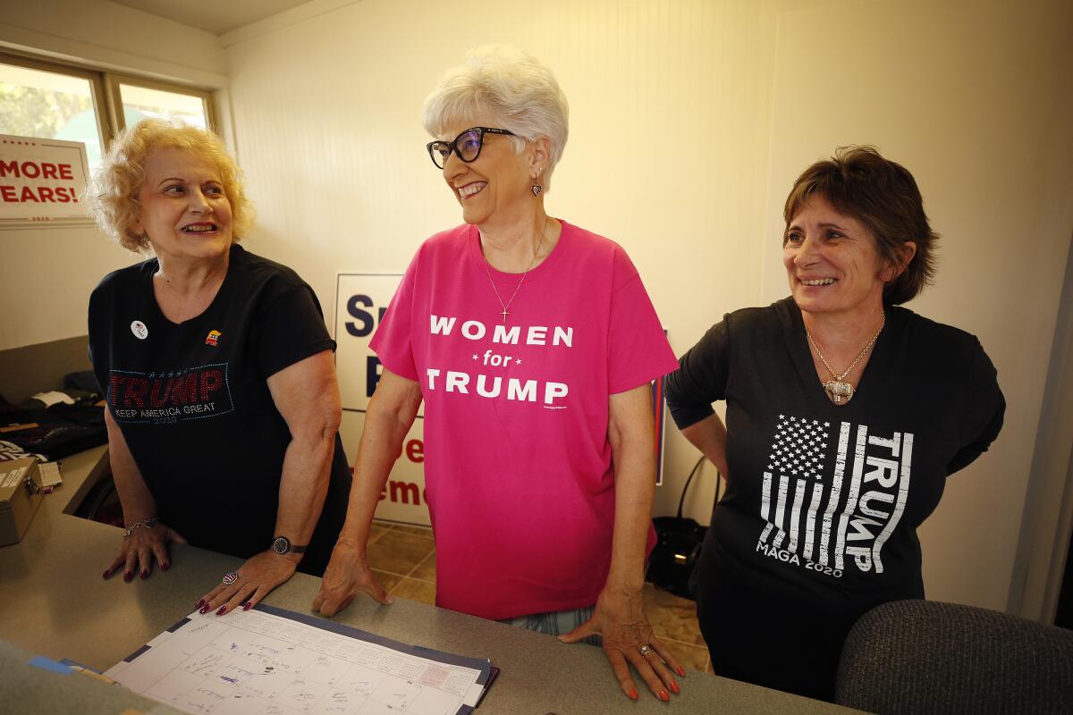 Volunteers Pam Mills, left, Mary Jane Loya and Kim Harmon at the Kings County Republican headquarters.