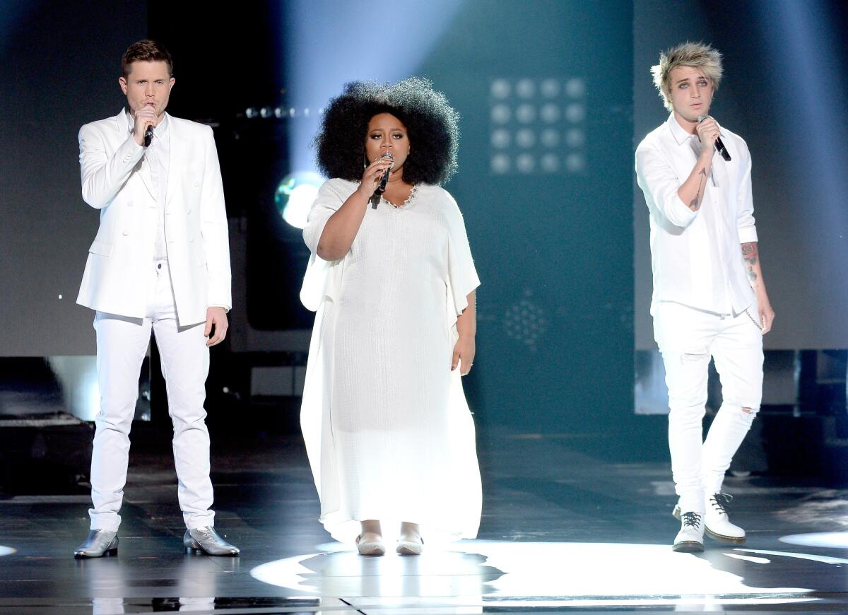 Singers Trent Harmon, left, La'Porsha Renae and Dalton Rapattoni perform onstage during Fox's "American Idol" finale
