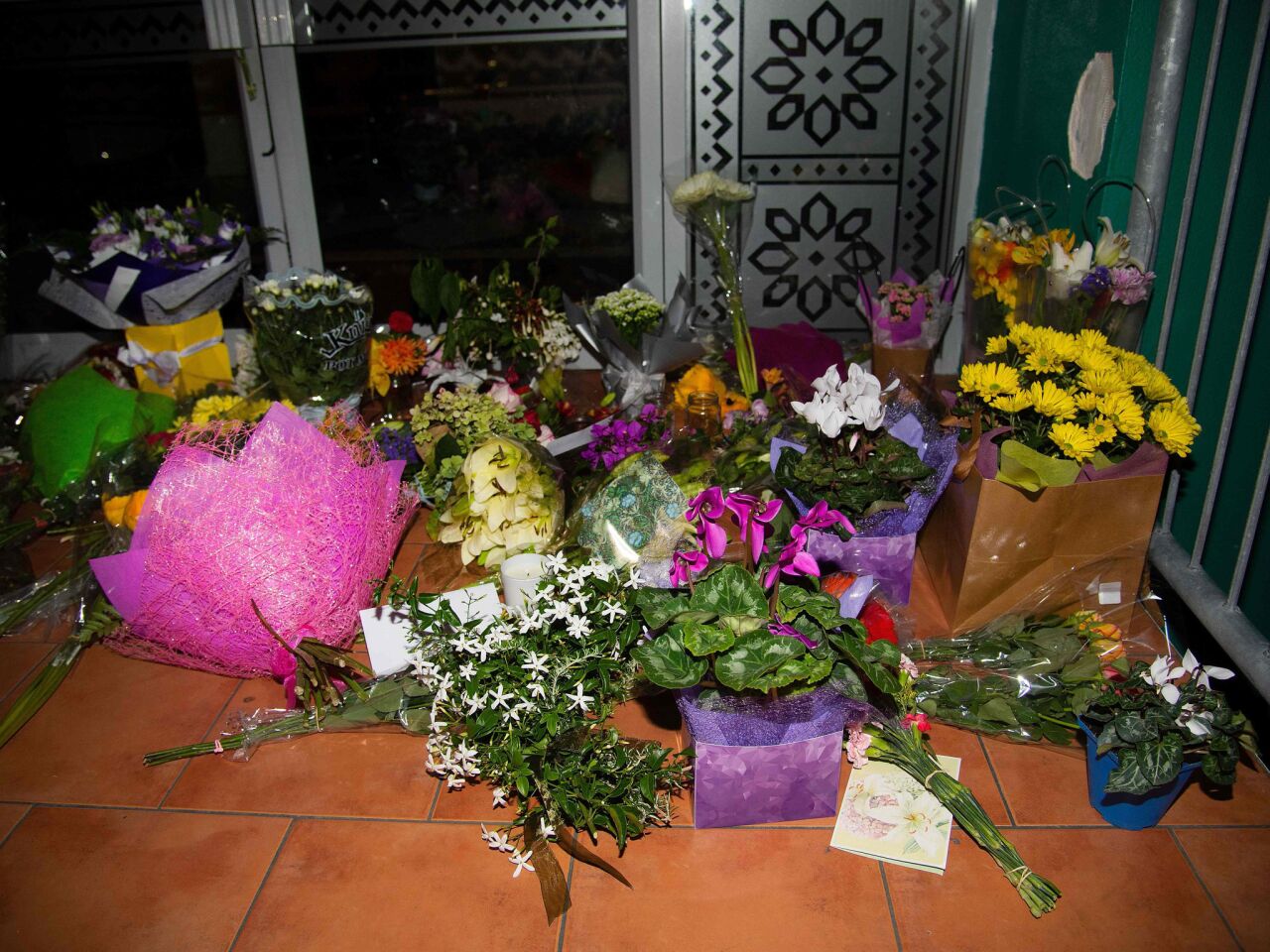 Flowers are placed on the front steps of the Wellington Masjid mosque in Kilbirnie in Wellington after a shooting incident at two mosques in Christchurch.