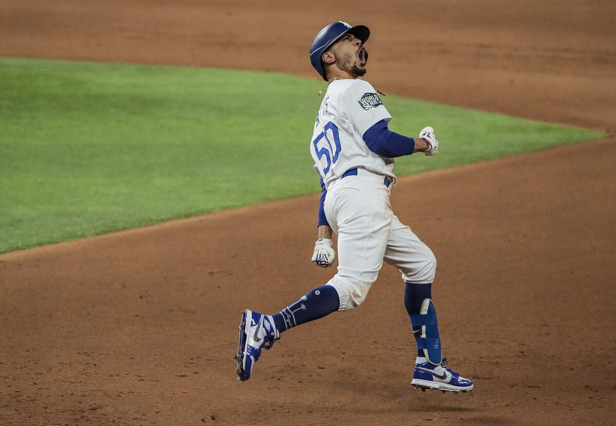 The Los Angeles Dodgers' Mookie Betts celebrates after hitting a home run in the eighth inning of Game 6 of the World Series.