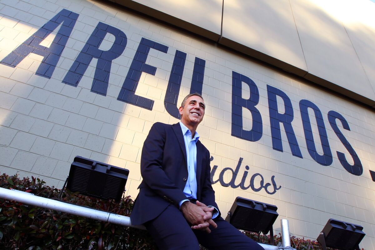 Founder & CEO of Areu Bros.Studios, Ozzie Areu, a Cuban American, in front of their sign at their film studio that was the former home of Tyler Perry Studios in Atlanta, Ga.
