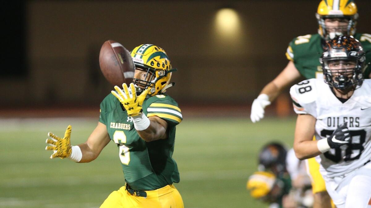 Edison High's Isaiah Palmer makes a fingertip catch during a Sunset League game against Huntington Beach on Oct. 5.