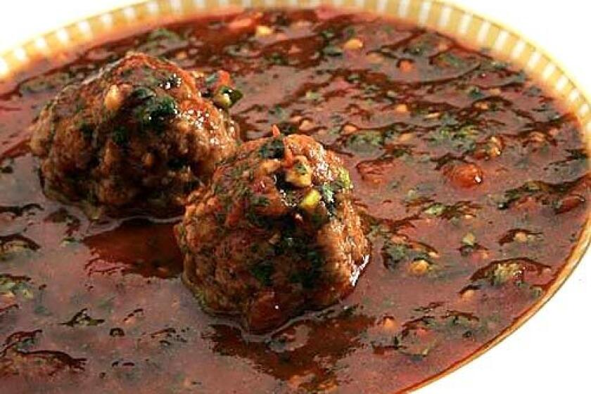 Spicy tomato soup is fortified with kibbeh meatballs.