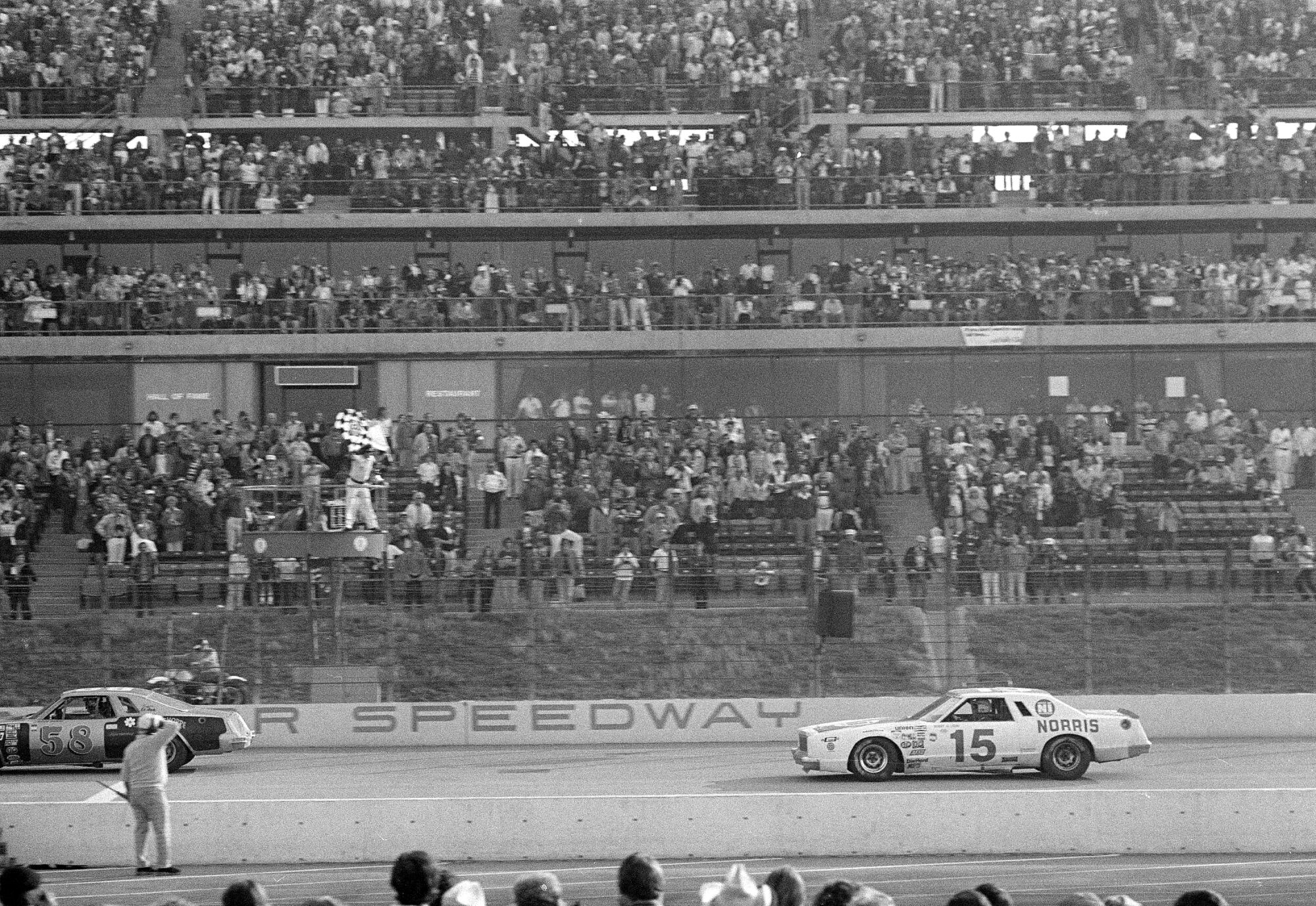 Bobby Allison takes the checkered flag as he crosses the finish line to win the Times 500 at Ontario Motor Speedway.