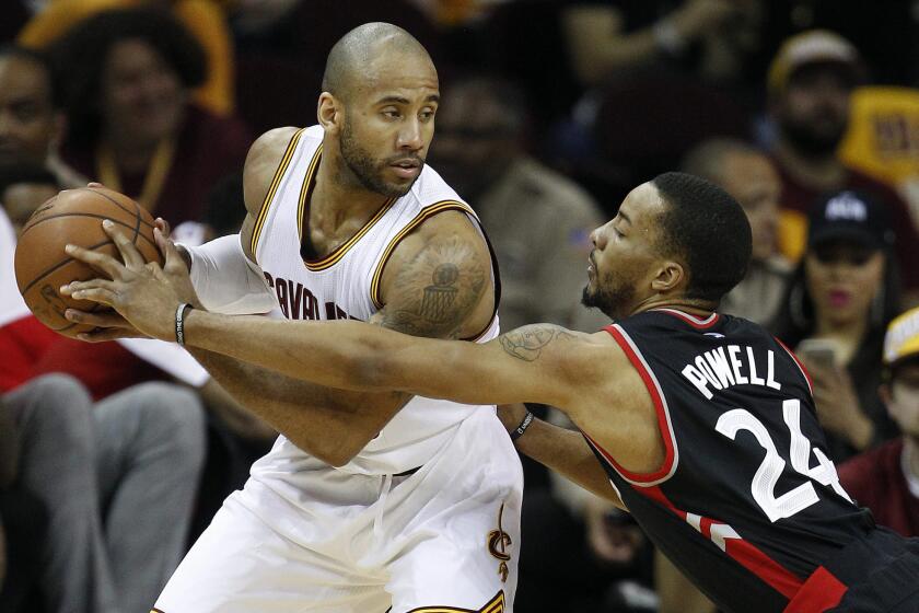 Raptors guard Norman Powell (24) defends against Cavaliers guard Dahntay Jones during the second half of Game 1.