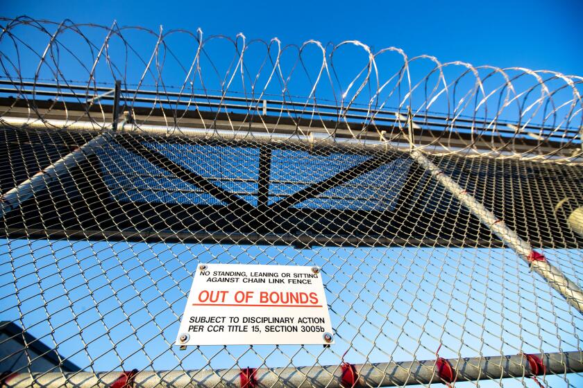Ione, CA - September 06: Barbed wire keeps inmate inside the perimeter at Mule Creek State Prison in on Wednesday, Sept. 6, 2023 in Ione, CA. (Brian van der Brug / Los Angeles Times)