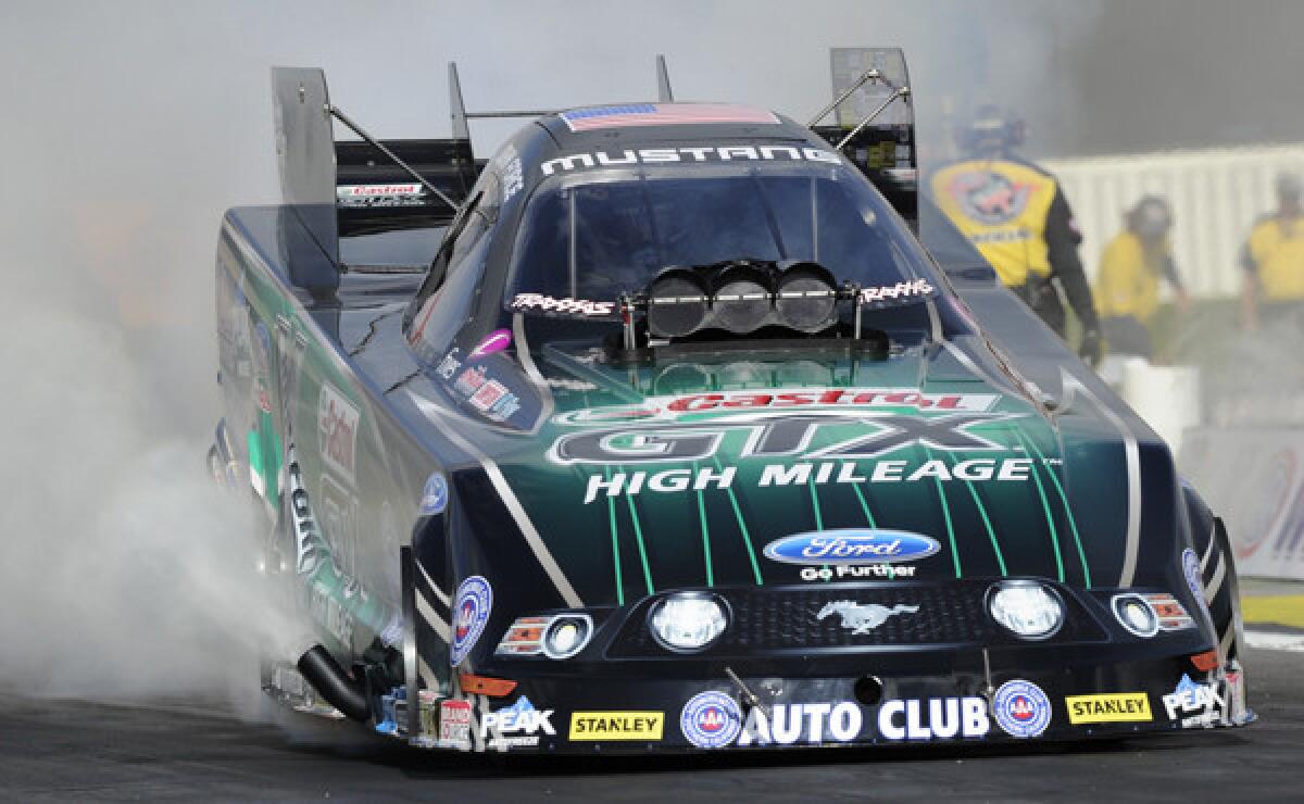 John Force takes part in Funny Car qualifying at the NHRA Winternationals in Pomona on Friday. Force won the season-opening event Sunday with a record-setting run.