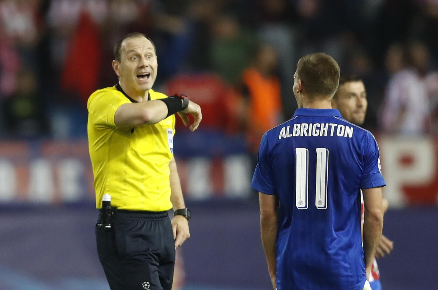 Referee Jonas Eriksson with Leicester City's Marc Albrightonafter the game