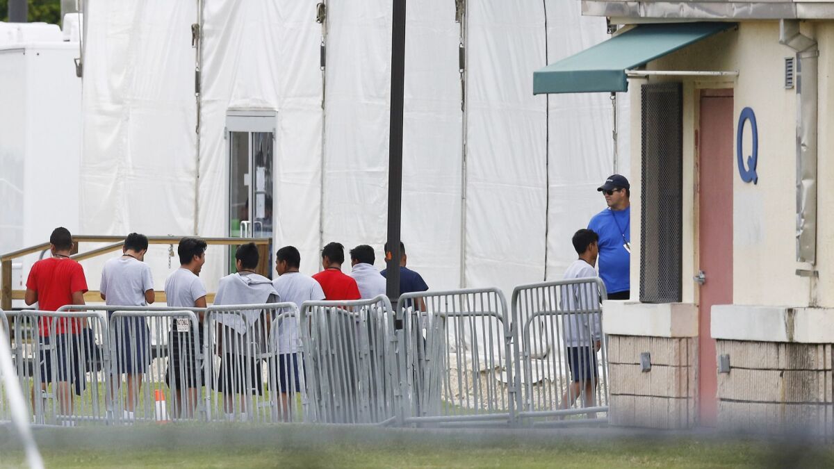 Immigrant children outside the Homestead Temporary Shelter for Unaccompanied Children, a former Job Corps site that now houses them, on Wednesday, June 20, 2018, in Homestead, Fla.