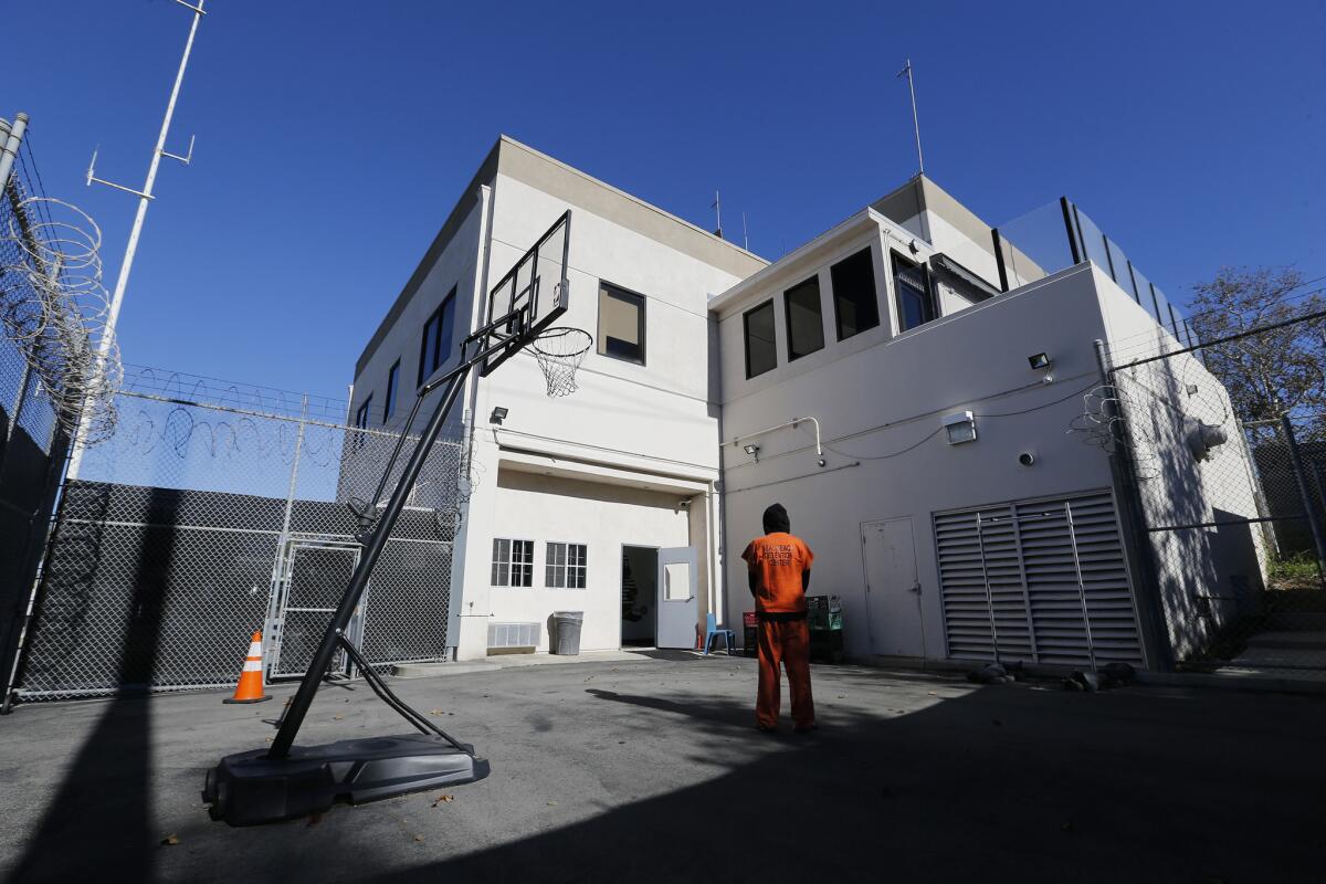 An inmate who is serving four months for DUI stands in the recreation yard at the Seal Beach Detention Center.
