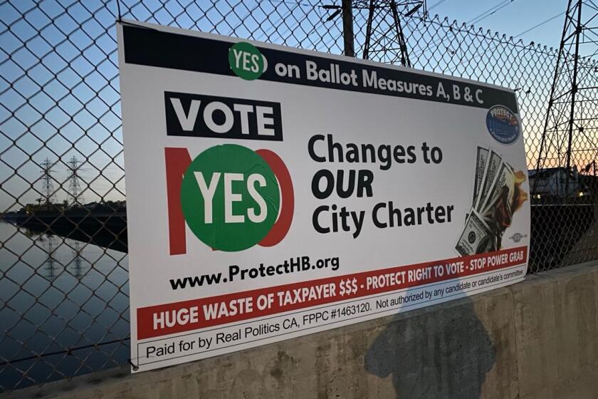 "Vote No on Measures A, B & C" signs were found vandalized Wednesday morning, with "Yes" stickers placed on them.