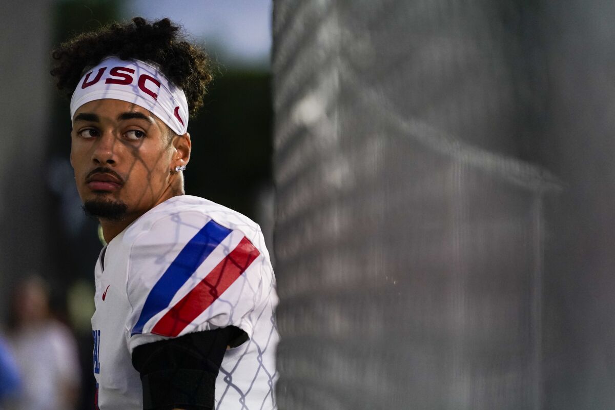 Los Alamitos High School quarterback Malachi Nelson waits to enter the field before a high school football game.