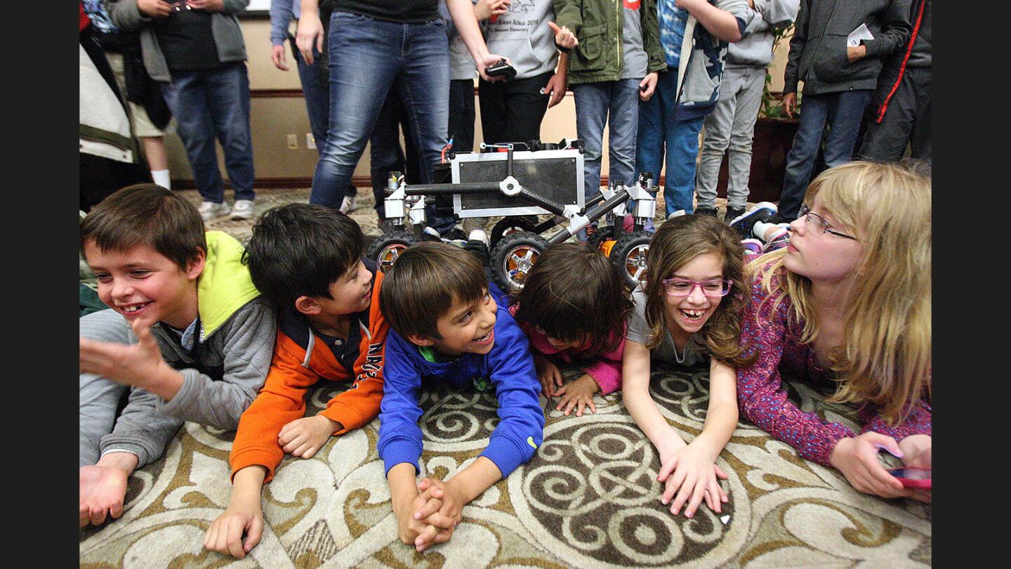 The feeling of the robot rolling over the children made almost all of the laugh at the Buena Vista Library on Tuesday, January 24, 2017. Megan Richardson, a mechanical engineer at JPL, presented an entertaining look at robots on Mars, on the road, and climbing over things.
