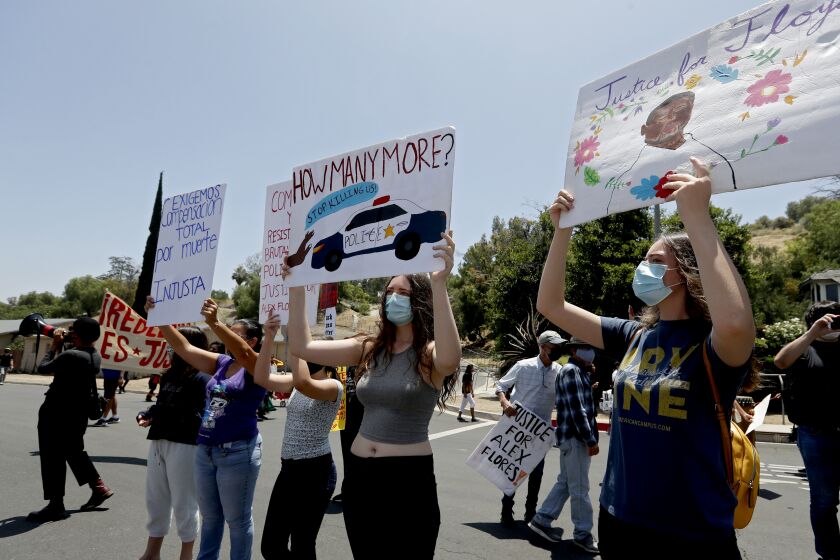 GRANADA HILLS, CALIF. - JUNE 19, 2020. Protesters call for the removal from office of Los Angeles County District Attorney Jackie Lacey during a small and noisy protest in Lacey's Granada Hills neighborhood on Saturday, June 20, 2020. Critics allege that Lacey, who is up for re-election, has failed to prosecute ciops accused of brutality and unjust killings. (Luis Sinco/Los Angeles Times)