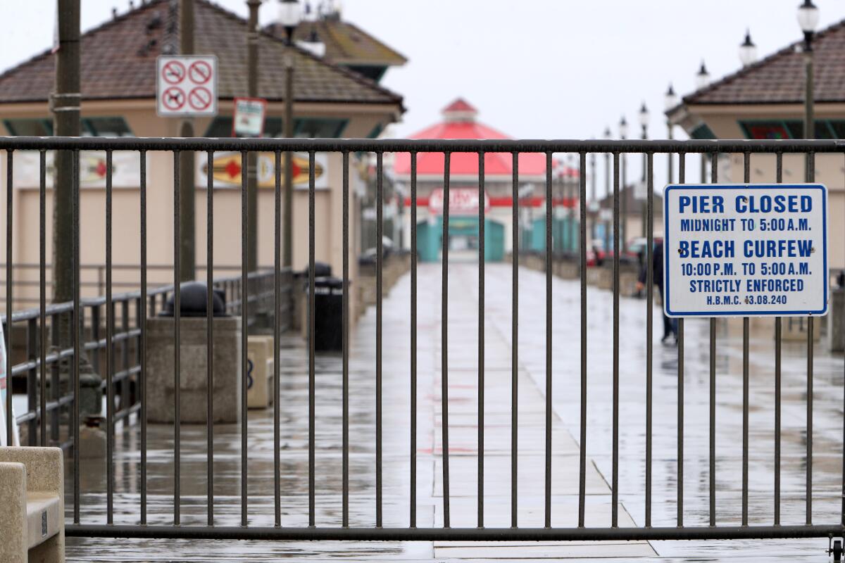 The Huntington Beach Pier remained closed on a rainy Friday.