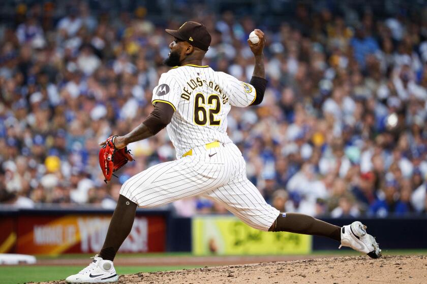 San Diego, CA - May 11: San Diego Padres relief pitcher Enyel De Los Santos (62) pitches against the Los Angeles Dodgers during the sixth inning at Petco Park on Saturday, May 11, 2024 in San Diego, CA. (Meg McLaughlin / The San Diego Union-Tribune)