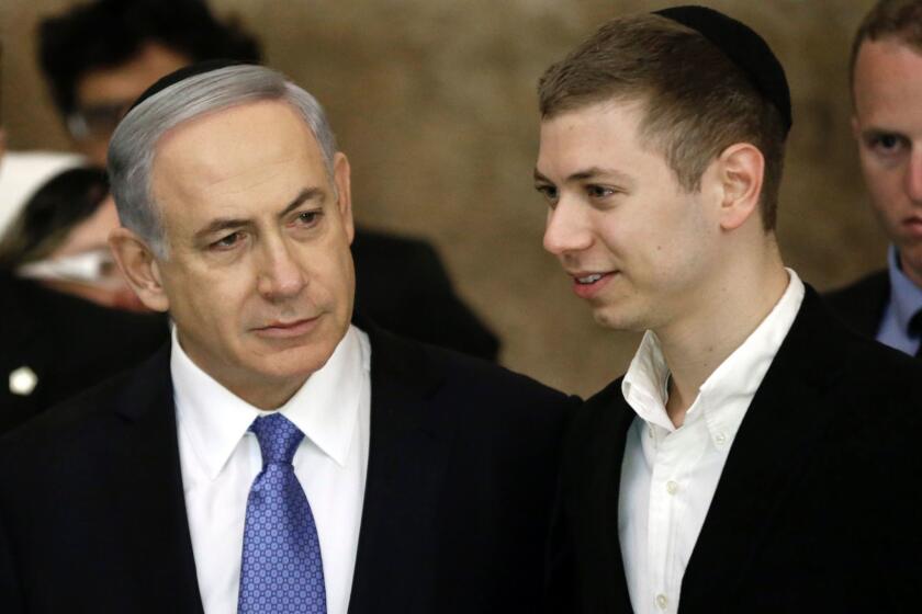 Israeli Prime Minister Benjamin Netanyahu (L) and his son Yair visit, on March 18, 2015, the Wailing Wall in Jerusalem following his party Likud's victory in Israel's general election. Netanyahu swept to a stunning election victory, securing a third straight term for an Israeli leader who has deepened tensions with the Palestinians and infuriated key ally Washington. AFP PHOTO / THOMAS COEX / AFP / THOMAS COEX (Photo credit should read THOMAS COEX/AFP/Getty Images) ** OUTS - ELSENT, FPG, CM - OUTS * NM, PH, VA if sourced by CT, LA or MoD **