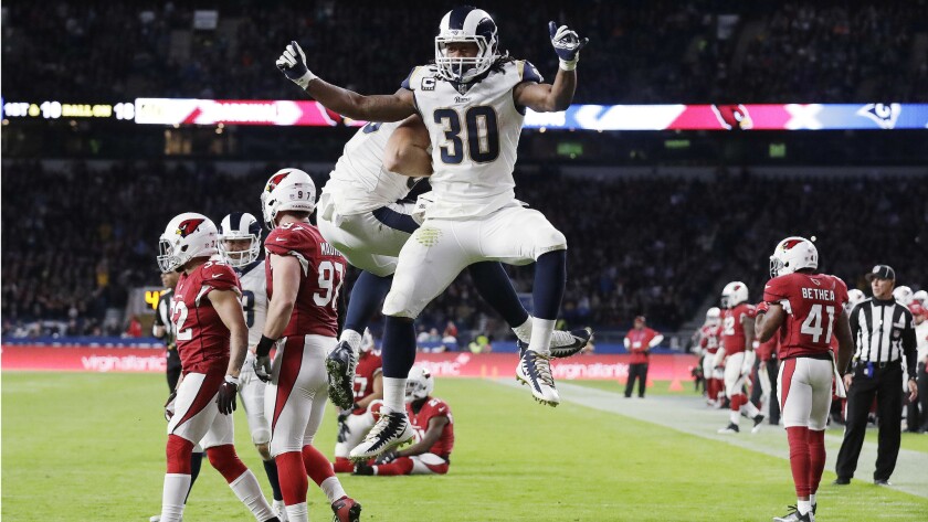 Rams running back Todd Gurley (30) celebrates after scoring a touchdown during the first half against the Arizona Cardinals on Sunday.