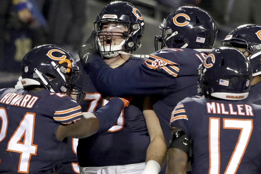 Chicago Bears offensive tackle Bradley Sowell (79) celebrates a touchdown reception with teammates during the second half of an NFL football game against the Los Angeles Rams Sunday, Dec. 9, 2018, in Chicago. (AP Photo/Nam Y. Huh)