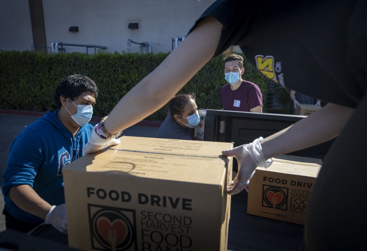 Restaurant workers who had been laid off were hired as temporary employees at Second Harvest Food Bank of Orange County.