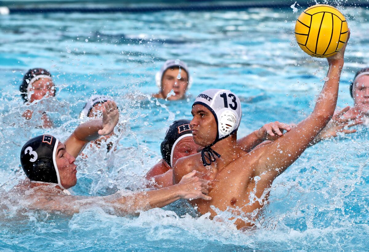Newport Harbor's Ben Liechty takes a shot on goal under pressure.