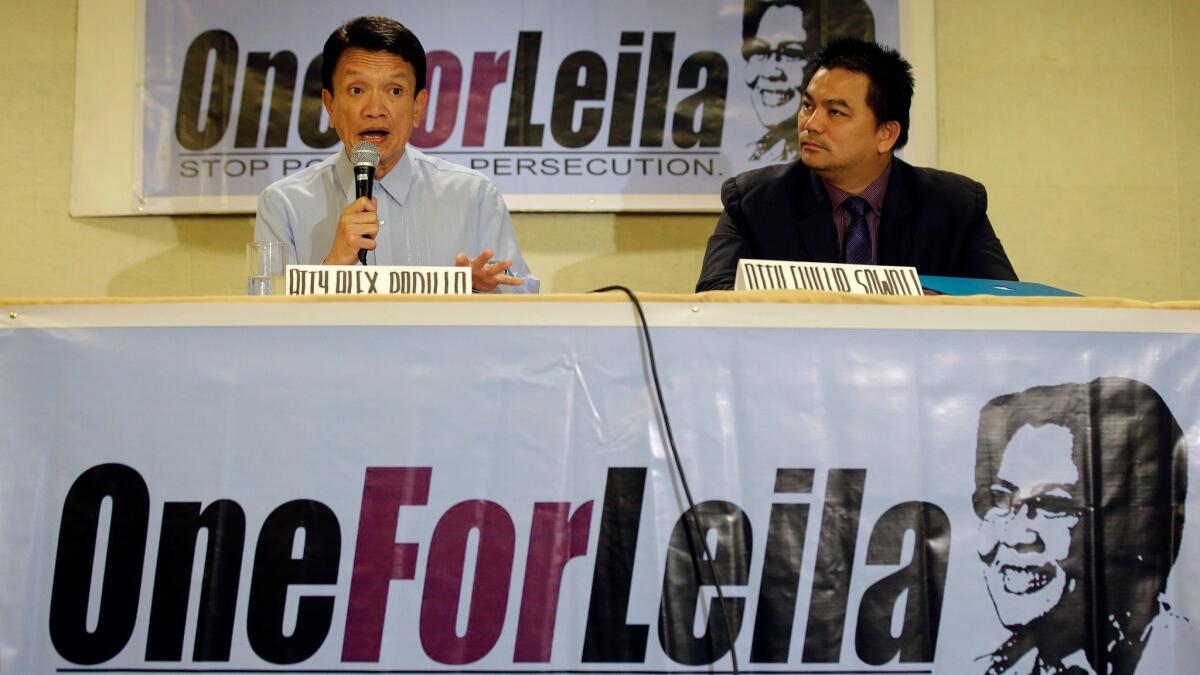 Alex Padilla, left, lawyer of detained Philippine Sen. Leila De Lima, speaks during a news conference Feb. 27 in Manila.