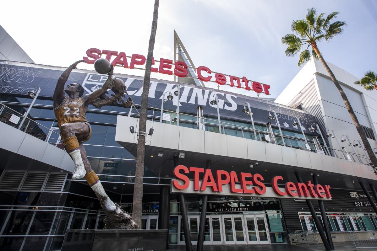 A statue of Lakers legend Elgin Baylor stands outside Staple Center, which will soon be called  Crypto.com Arena.