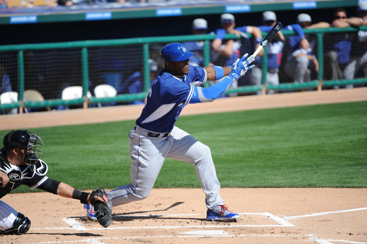 Yasiel Puig drove in a run during the first inning of the Dodgers' 6-1 victory over the Chicago White Sox on Thursday in a spring training game at Camelback Ranch in Phoenix.