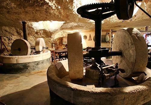 Masseria Il Frantoio, near Ostuni, Italy, houses a huge hypogeum olive press for producing oil in a natural cave.