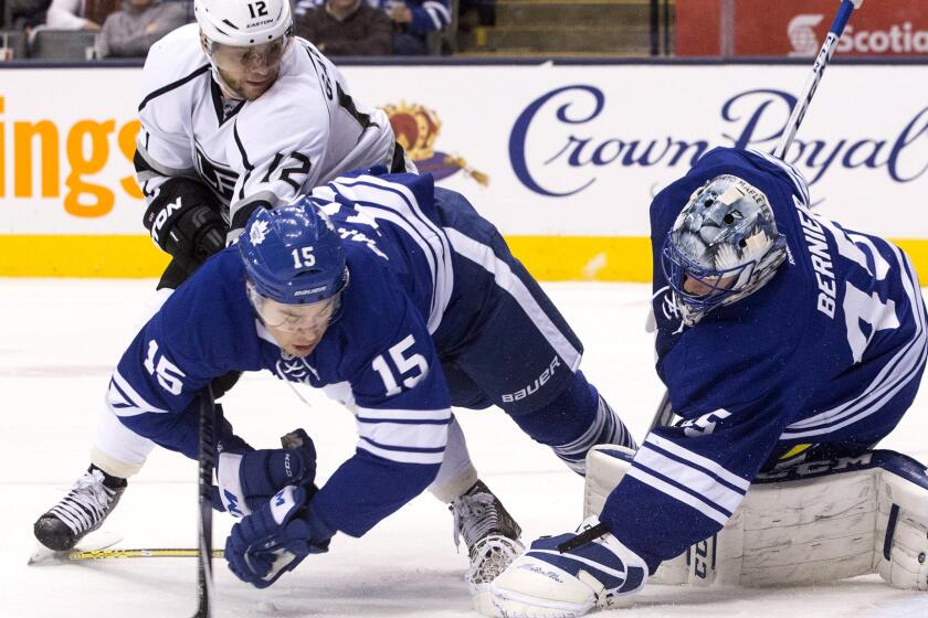 Kings right wing Marian Gaborik looks for a rebound as Maple Leafs goaltender Jonathan Bernier stops a shot and right wing Pierre-Alexandre Parenteau (15) falls to the ice Saturday.