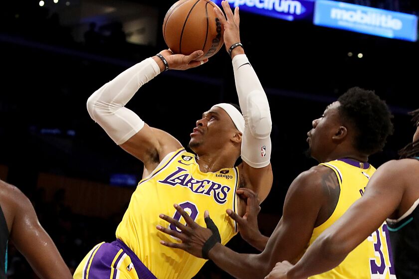 LOS ANGELES, CALIF. - NOV. 30, 2022. Lakers guard Russell Westbrook gets fouled en route to the. basket against the Blazers in the first quarter of the game at crypto.com Arena in Los Angeles on Wednesday night, Nov. 30, 2022. (Luis Sinco / Los Angeles Times)