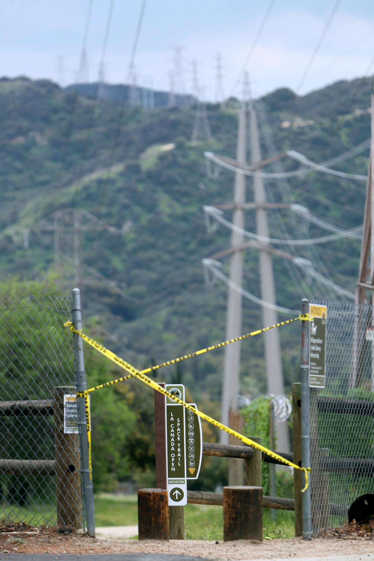 Caution tape wards off would-be hikers as La Cañada's trail system is shut down to help slow the spread of the novel coronavirus.