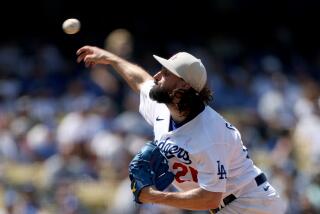 LOS ANGELES, CALIFORNIA - MAY 14: Tony Gonsolin #26 of the Los Angeles Dodgers pitches.