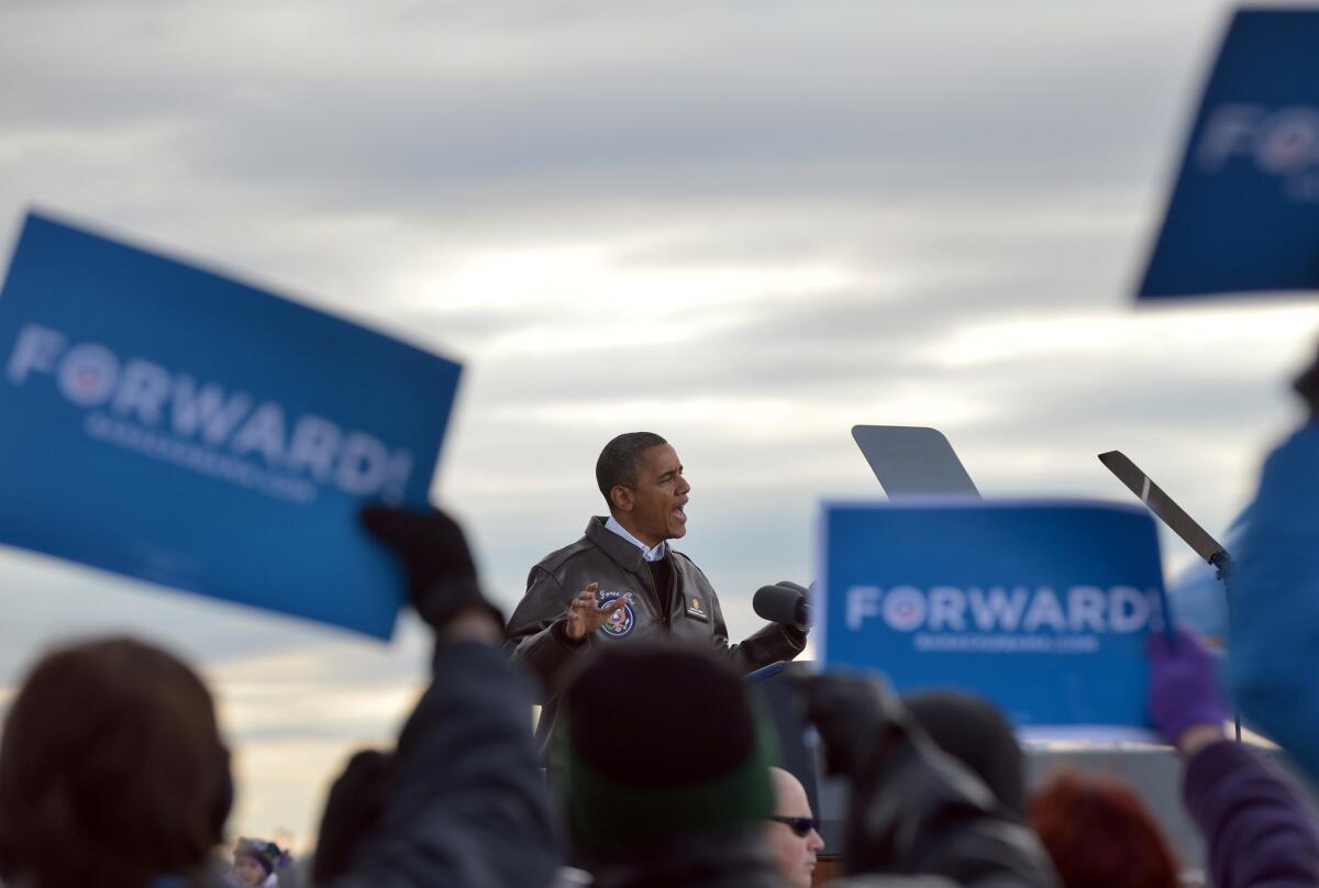 President Obama speaks during a campaign rally at Austin Straubel International Airport in Green Bay, Wis.