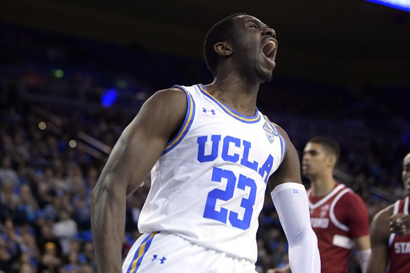 UCLA guard Prince Ali celebrates after dunking during the second half of the team's NCAA college basketball game against Stanford on Thursday, Jan. 3, 2019, in Los Angeles. UCLA won 92-70. (AP Photo/Mark J. Terrill)