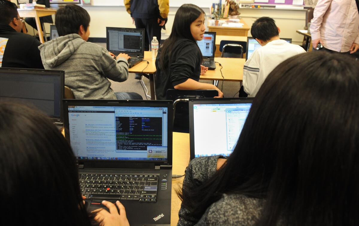 Students at Franklin High School sit at computers during class. A bill would pave the way for computer classes to be counted toward math requirements for admission to state universities.