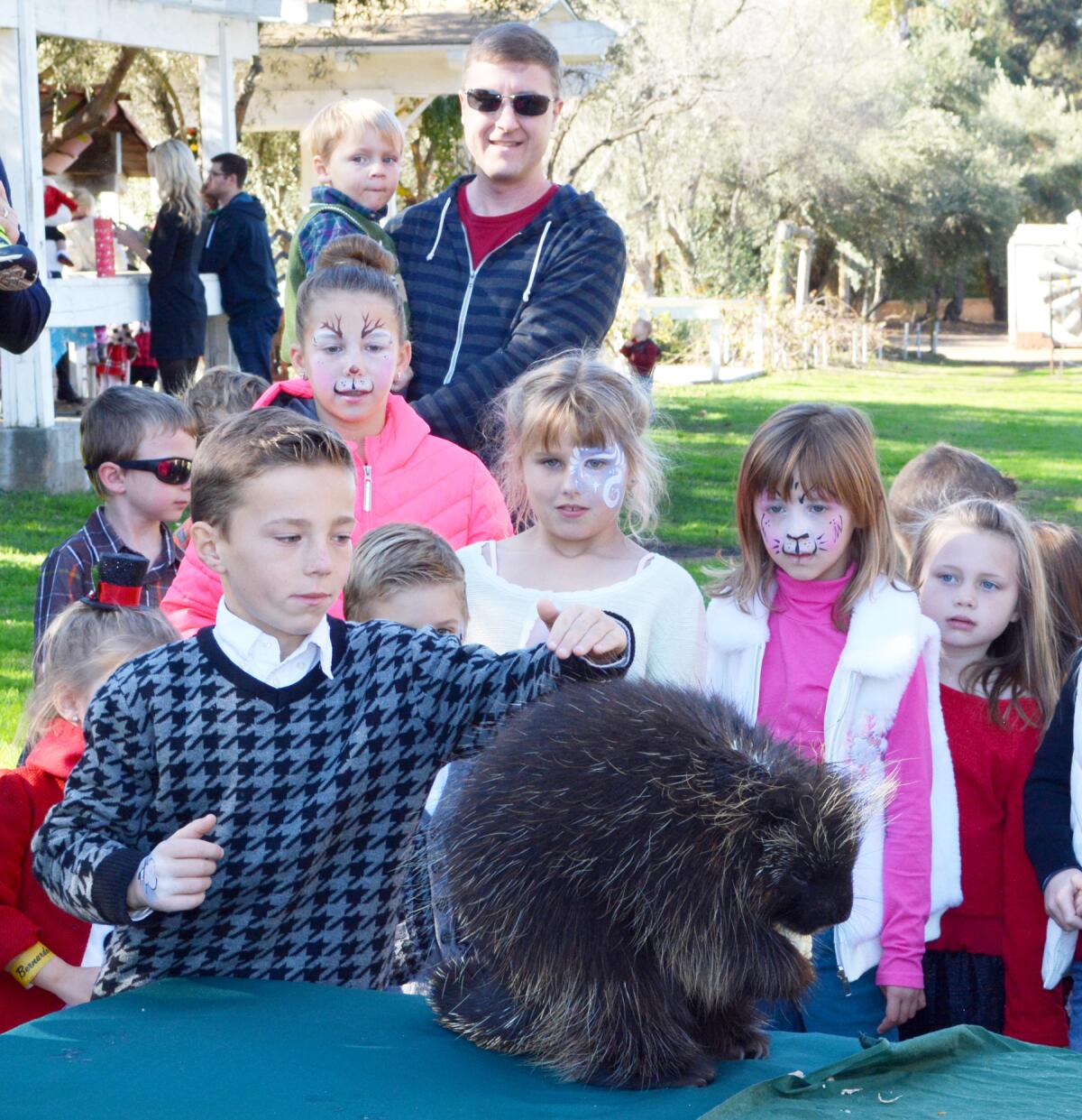 Children meeting an animal ambassador from Wild Wonders during a previous "Breakfast with Santa" at Bernardo Winery.