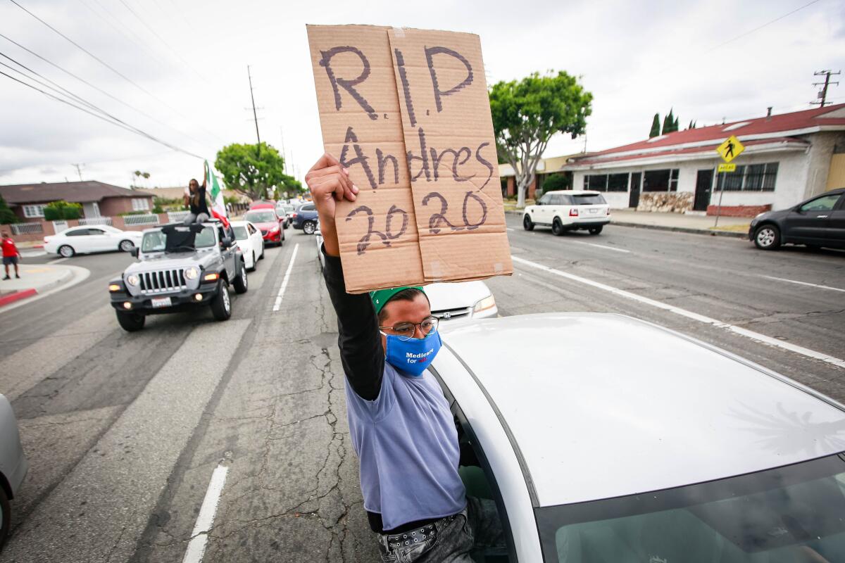 Relatives of Andres Guardado, who was fatally shot by a sheriff's deputy in Gardena, participate in rally
