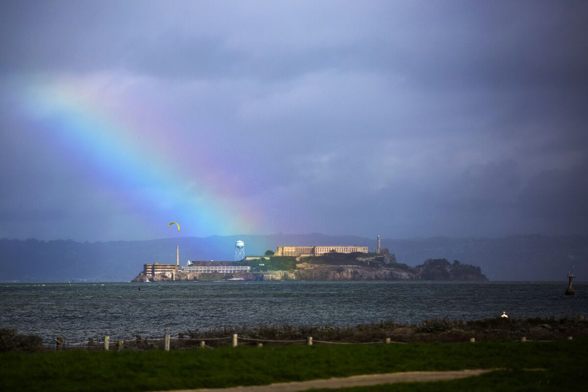 A rainbow over Alcatraz Island in a view from Crissy Field at the Golden Gate National Recreation Area.