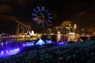 SINGAPORE - DECEMBER 31: Drones are seen in the sky forming the shape of a countdown clock by Star Island as Singapore awaits to celebrate the biggest countdown celebration at Marina Bay on December 31, 2019 in Singapore. (Photo by Suhaimi Abdullah/Getty Images) ** OUTS - ELSENT, FPG, CM - OUTS * NM, PH, VA if sourced by CT, LA or MoD **