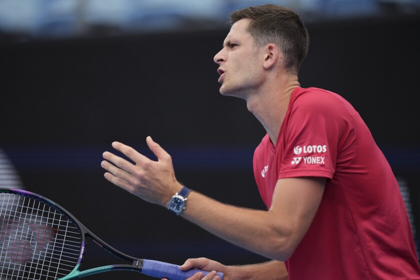 Poland's Hubert Hurkacz argues a call while playing Georgia's Aleksandre Metreveli during their match at the ATP Cup tennis tournament in Sydney, Monday, Jan. 3, 2022. (AP Photo/Rick Rycroft)