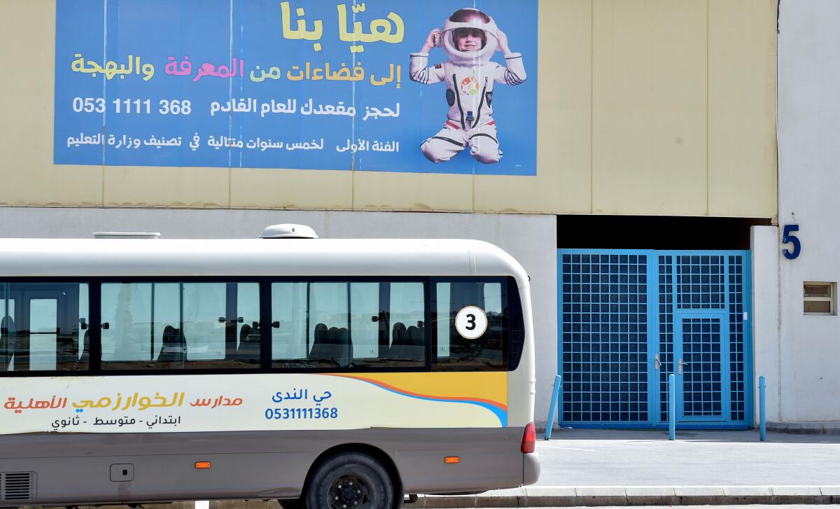 A bus is parked outside a closed private school in Riyadh, Saudi Arabia, on March 9.