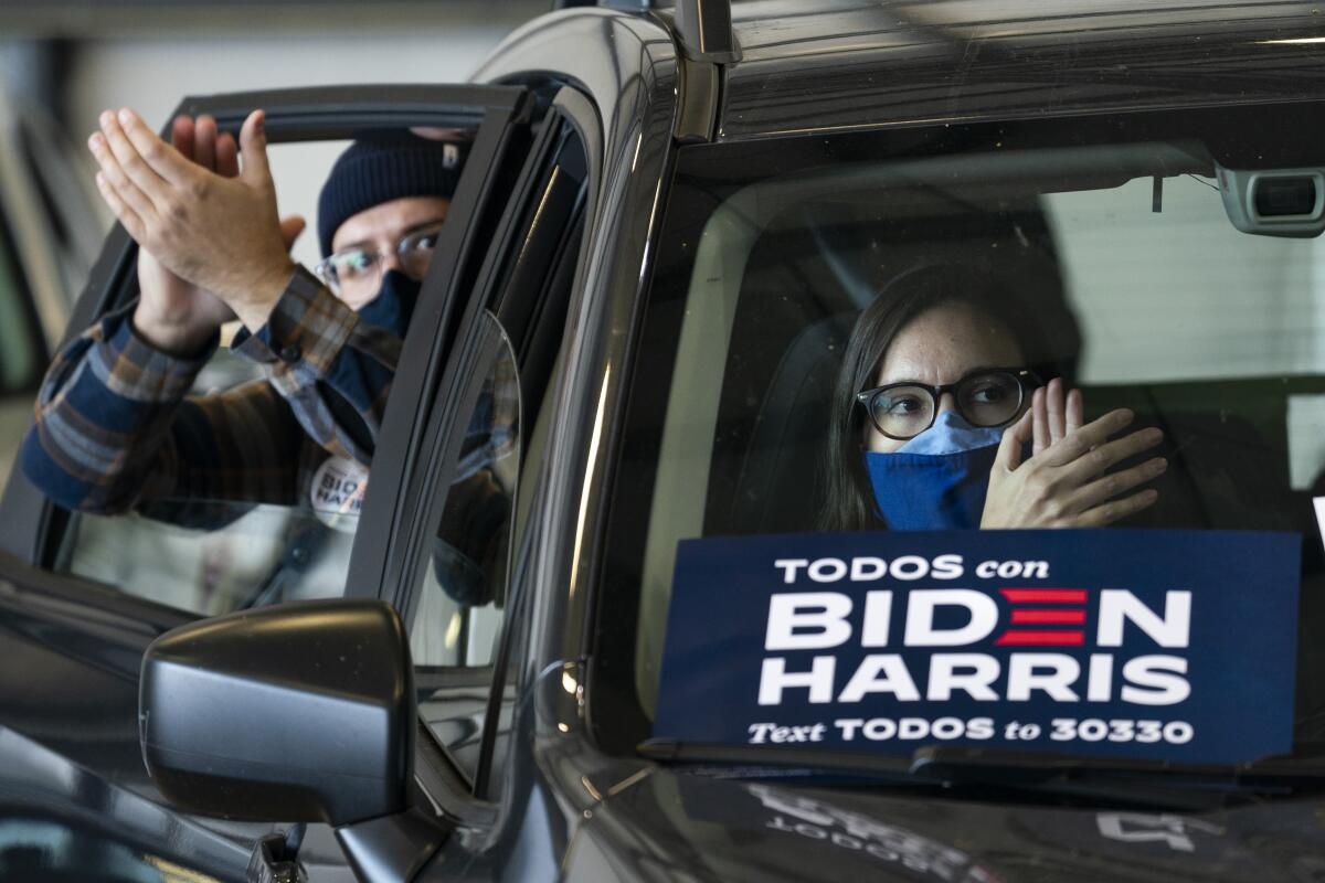 Supporters listen from their cars as Joe Biden speaks at a get-out-the-vote drive-in rally in Cleveland