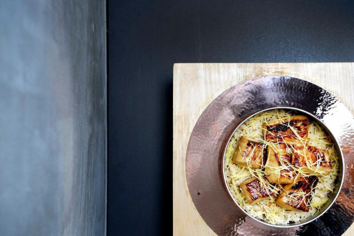 King mackerel and rice in a copper pot with yuzu zest at Hayato