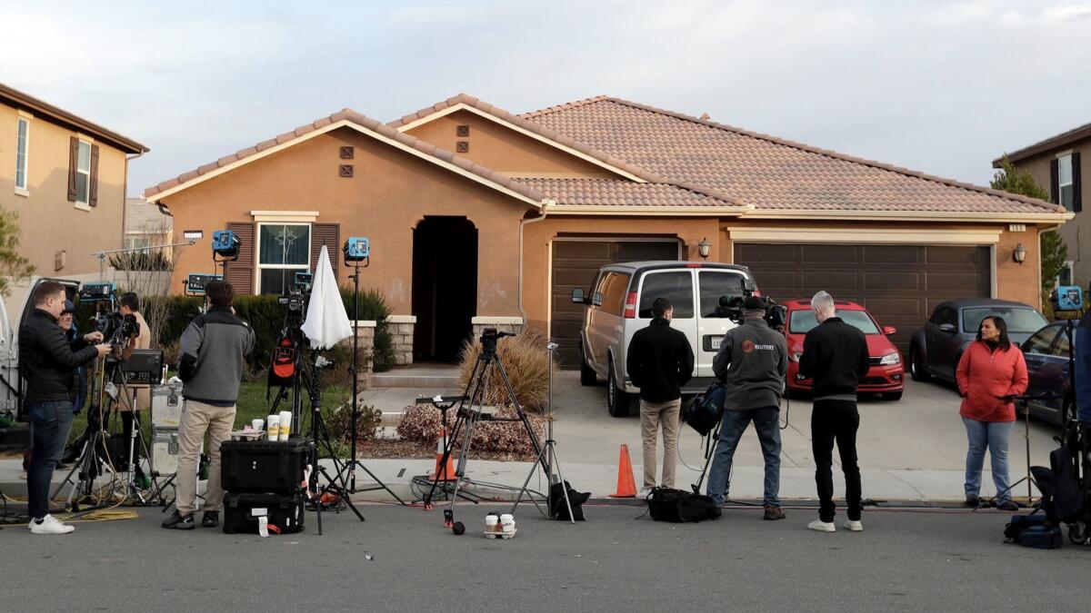 Members of the media camp out in front of the Perris home of David Allen and Louise Anna Turpin. The couple were arrested on suspicion of torture and child endangerment after their 13 children were found shackled and malnourished.