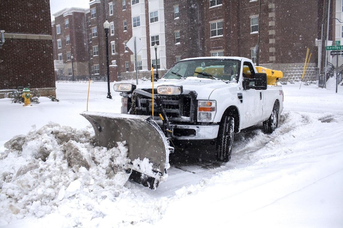 A plow clears a street Friday in Bowling Green, Ky.