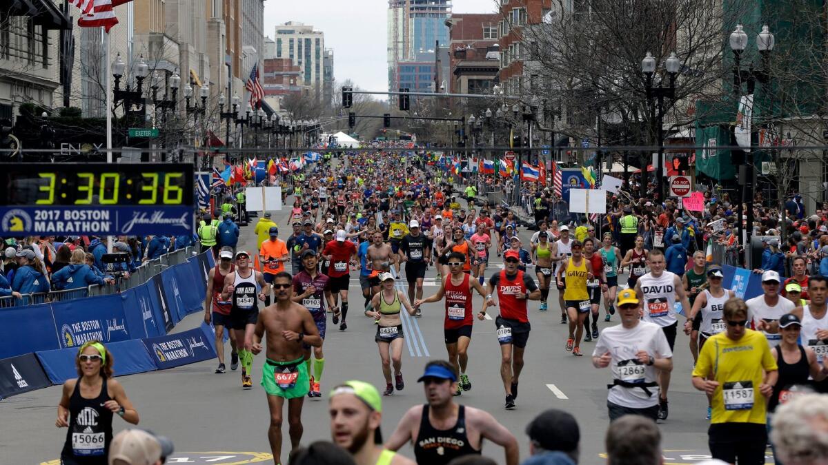 Runners head to the finish line in the 121st Boston Marathon.