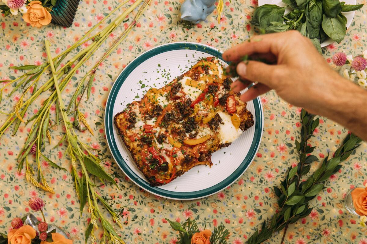 A rectangular piece of pizza from pop-up De La Nonna